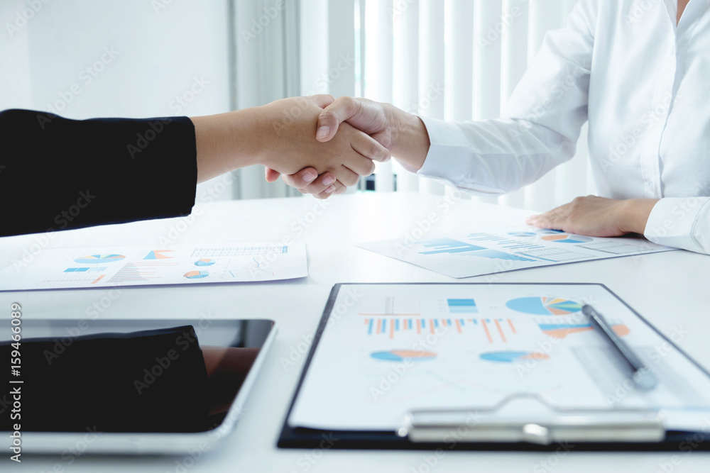 Business people shaking hands, finishing up a meeting Business people shaking hands, finishing up a meeting