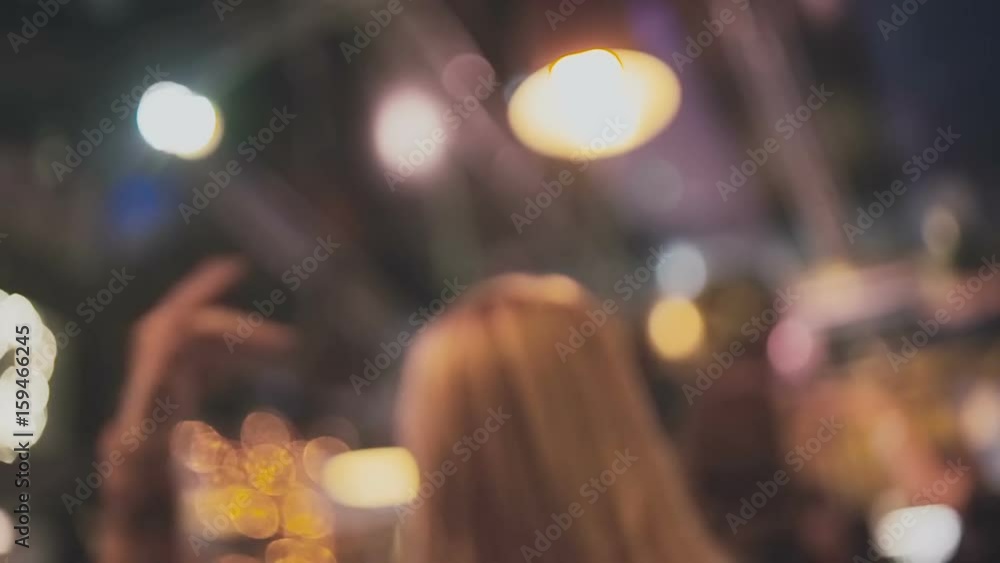 Young beautiful girl is dancing in the club, slowmotion