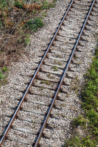 Railway track on gray gravel substrate