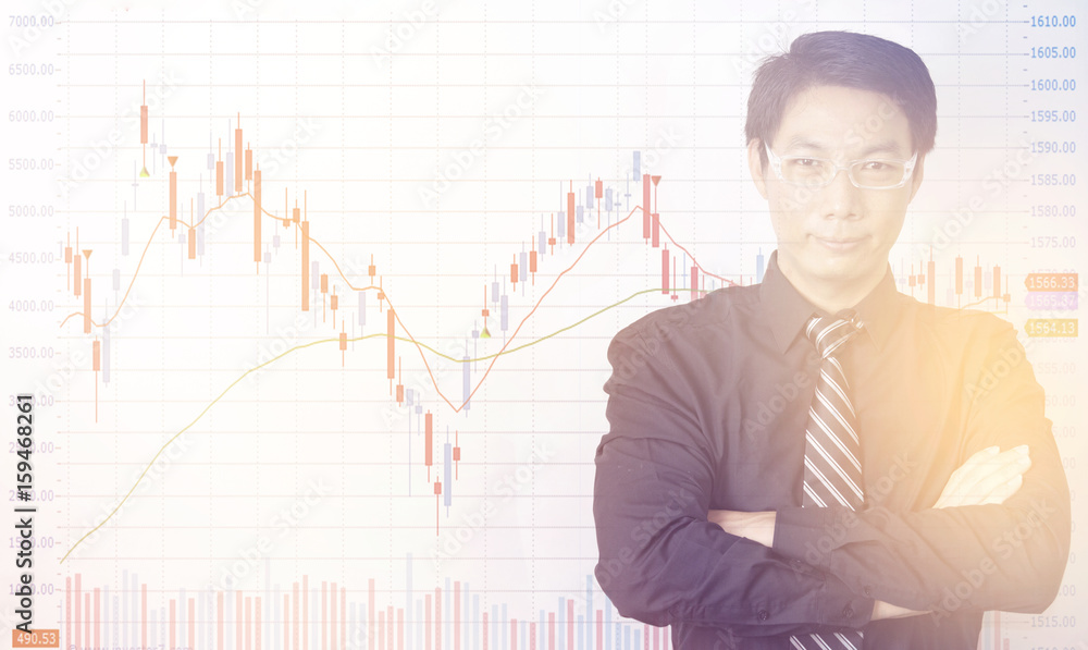 Businessman standing with business charts and graphs Businessman standing with business charts and graphs