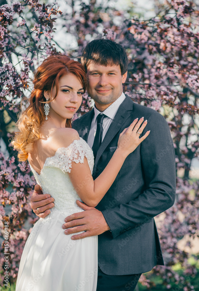 Stylish wedding on a gaden. Walk of lovers. A beautiful love story. Film colors. Stylish wedding on a gaden. Walk of lovers. A beautiful love story. Film colors.