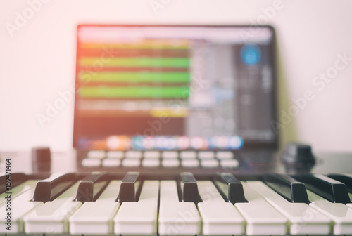 Photography Music keyboard with Computer running DAW music production program