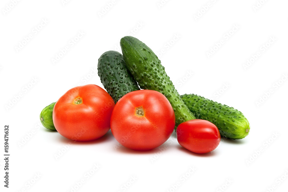 Tomatoes and cucumbers isolated on white background. Tomatoes and cucumbers isolated on white background.
