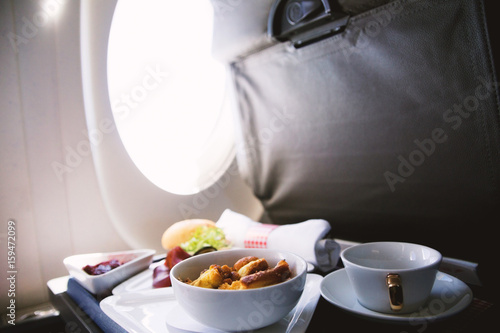 Food served on board of business class airplane on the table