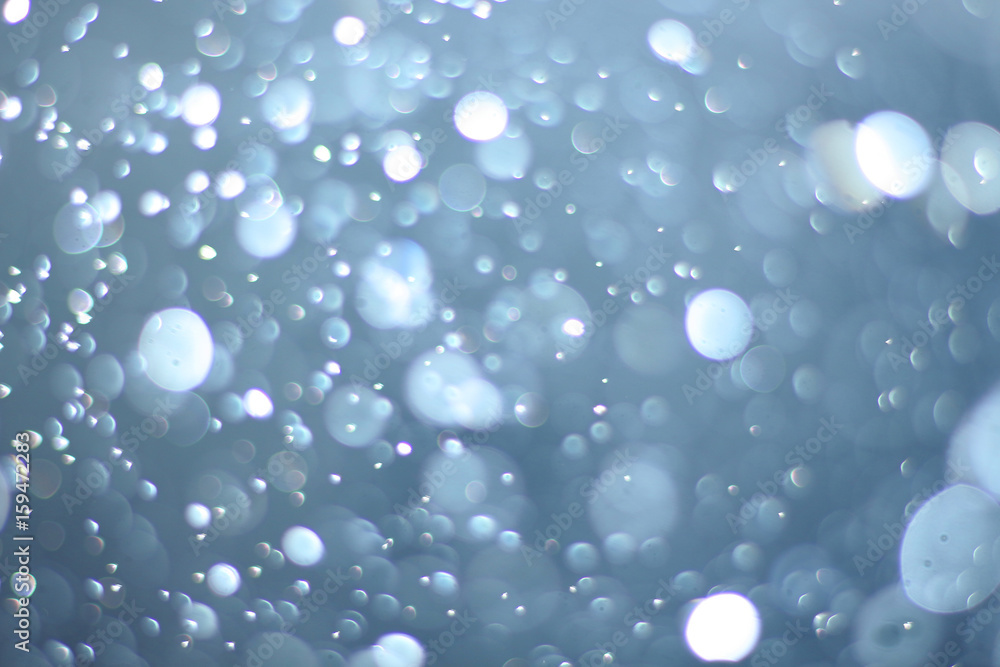 A beautiful and blurry bokeh on a blue background.