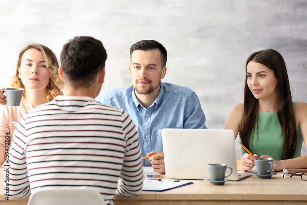 Human resources commission interviewing young man