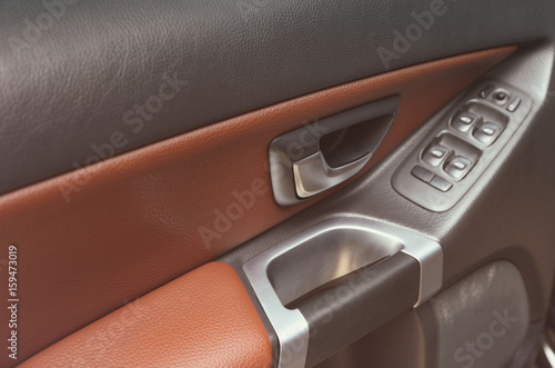 Interior view of car door with handles