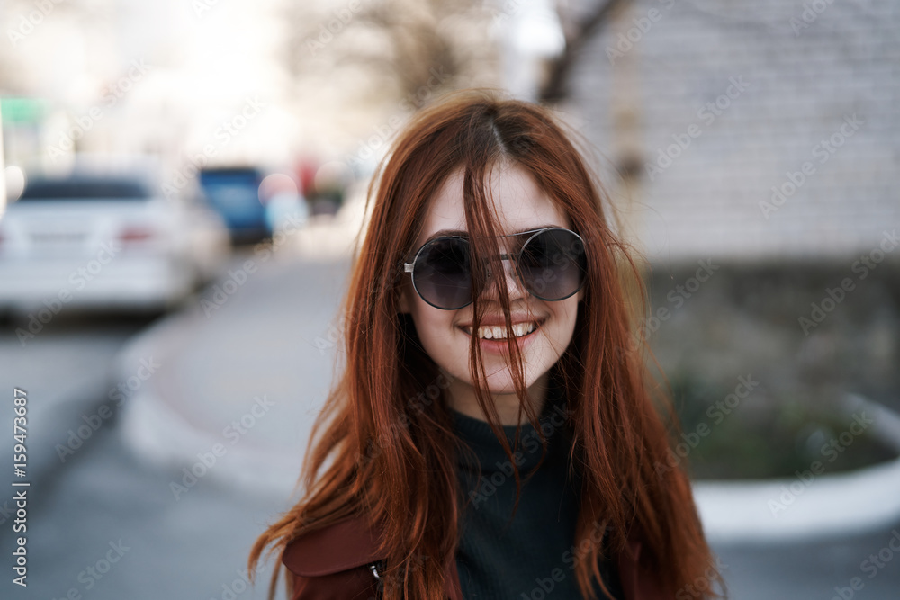 Smiling woman with glasses on the street Smiling woman with glasses on the street