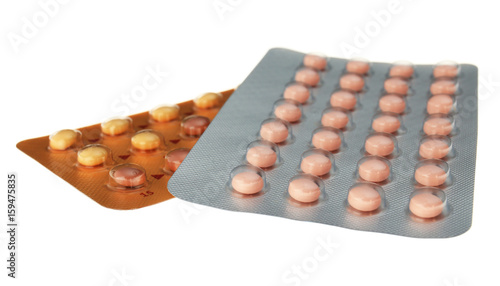 Oral contraception concept. Two packages of birth control pills on white background