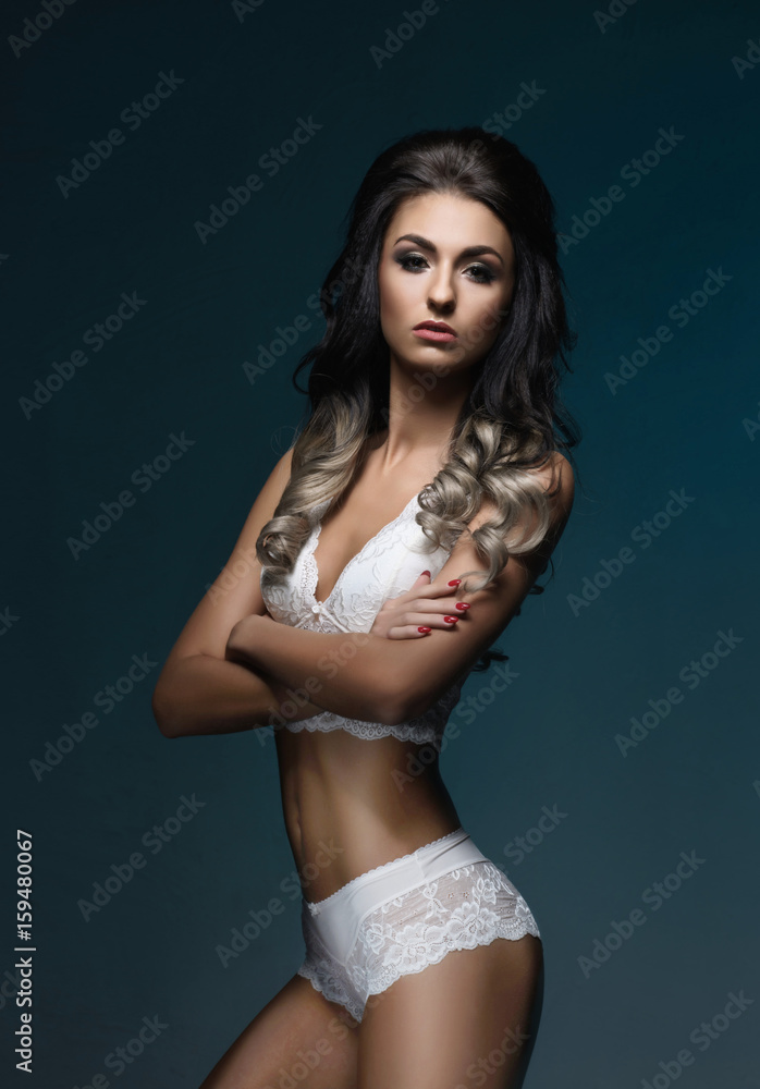Young and beautiful brunette girl posing in sexy lingerie. Fashion model in  erotic underwear. Stock Photo | Adobe Stock