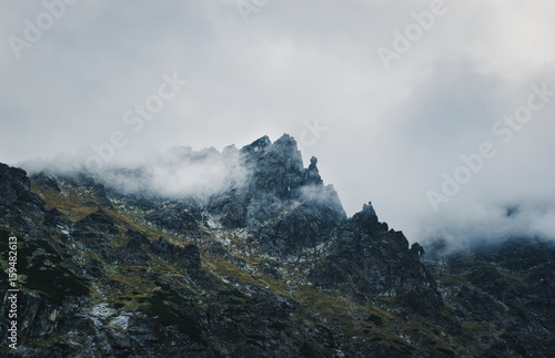 Fototapeta Naklejka Na Ścianę i Meble -  Mountain peak shrouded in storm clouds. Eastern Tatra Summits, Poland