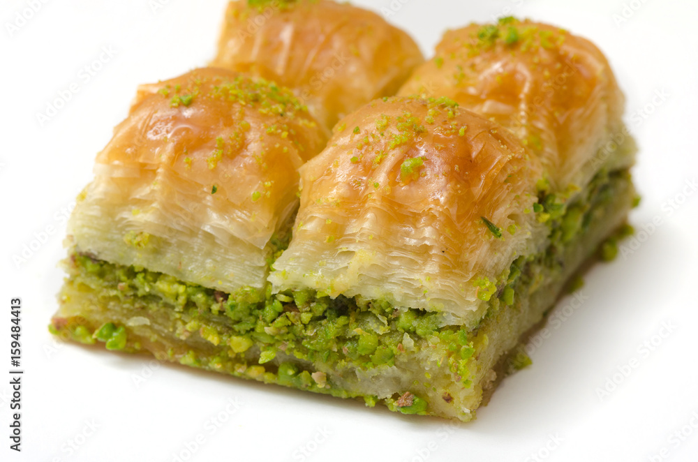 Baklava with pistachio on a white background Baklava with pistachio on a white background