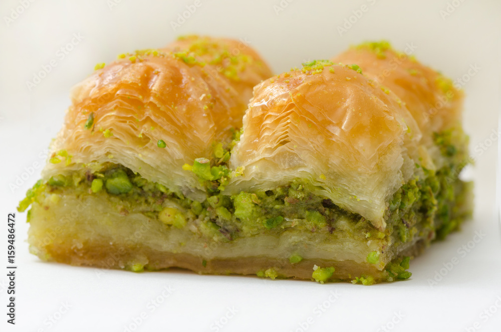 Baklava with pistachio on a white background Baklava with pistachio on a white background