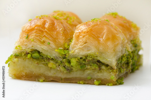 Baklava with pistachio on a white background