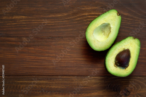 avocado on the wooden background, place for text.