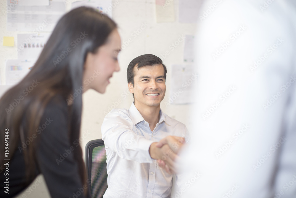 Businessman shaking hands greeting each other, 20-30 year old. Businessman shaking hands greeting each other, 20-30 year old.