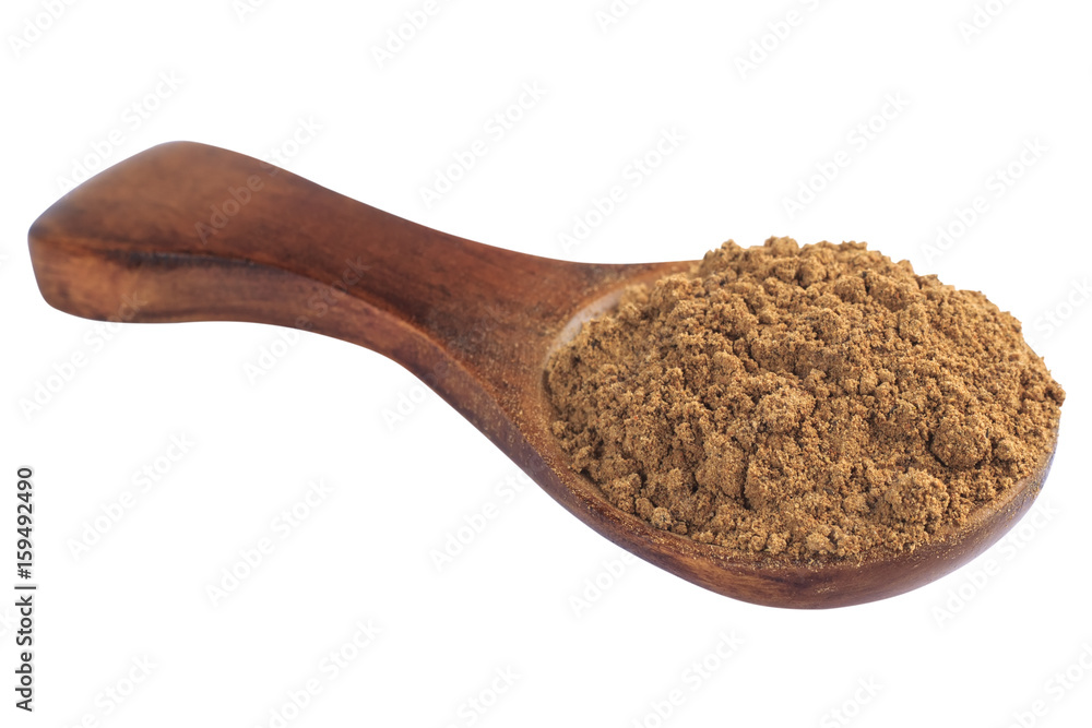Cinnamon in wooden spoon isolated on a white background Cinnamon in wooden spoon isolated on a white background