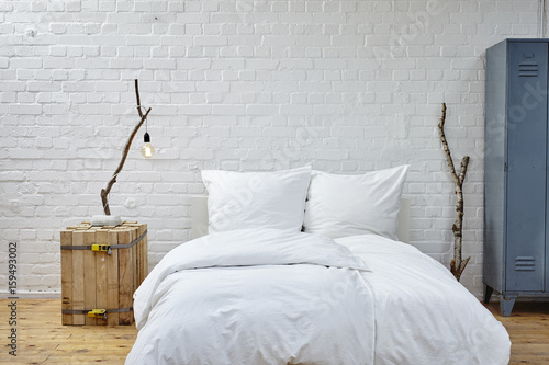 loft atmosphere bedroom white linen and birch branches