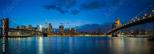Panoramic View Manhattan Bridge, Brooklyn Bridge and Manhattan Skyline at night