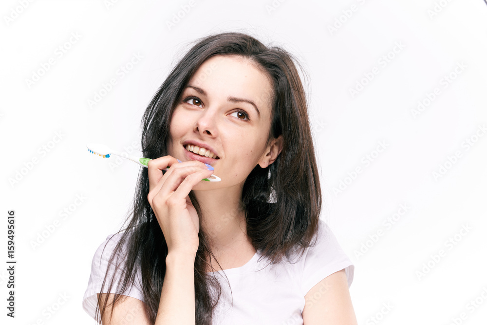 Woman dreaming, woman with toothbrush on isolated background portrait Woman dreaming, woman with toothbrush on isolated background portrait