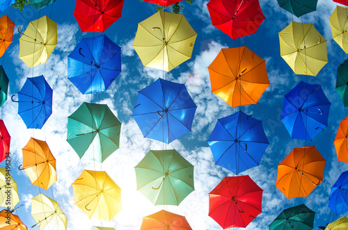 The sky of colorful umbrellas. Street with umbrellas.