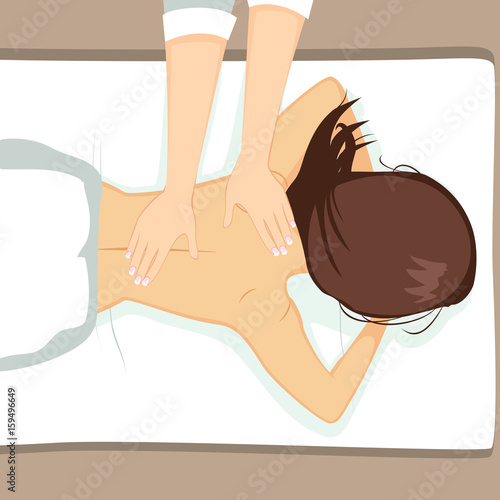 Young attractive woman having a massage on her back at spa