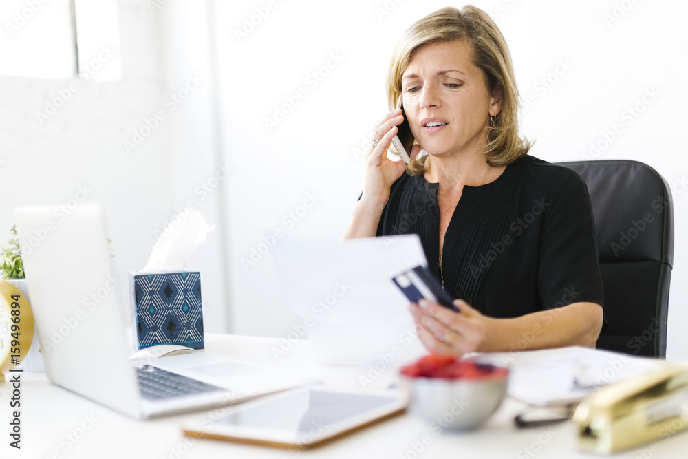Displeased Mature woman paying bills Displeased Mature woman paying bills
