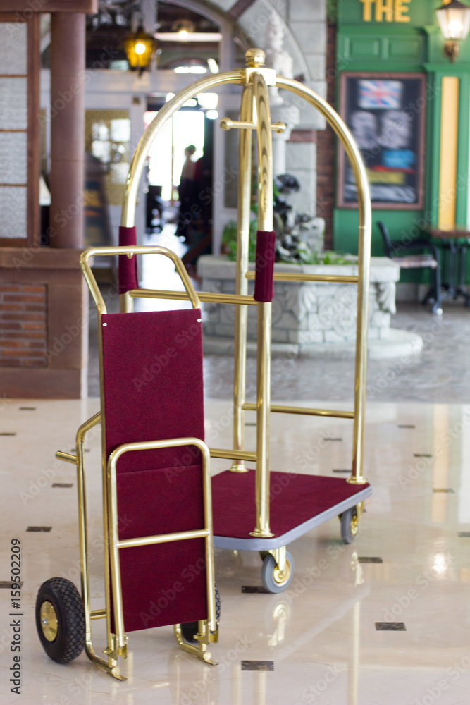 Luggage cart or hotel trolley in a luxury hotel on lobby zone.