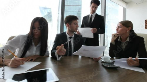 Business people work with documents in office