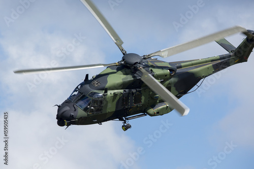 Fototapeta Naklejka Na Ścianę i Meble -  Modern tactical helicopter flying close.
