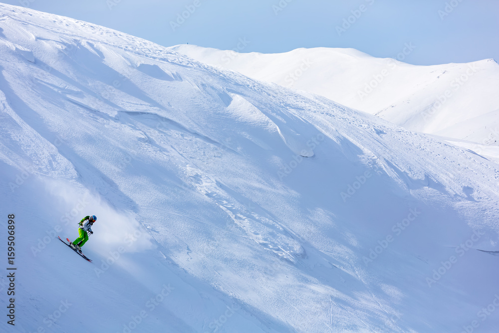 Skiing in the snowy mountains, Carpathians, Ukraine, good winter day, ski season.