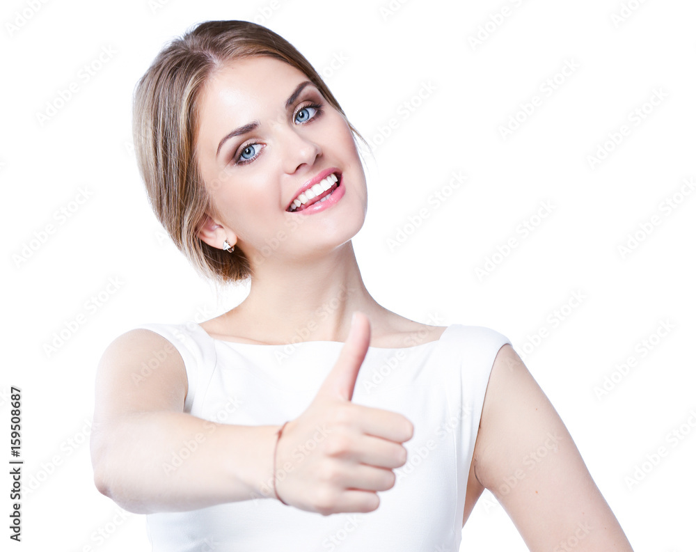 Studio portrait of a beautiful young woman standing against a white background and showing thumb up Studio portrait of a beautiful young woman standing against a white background and showing thumb up