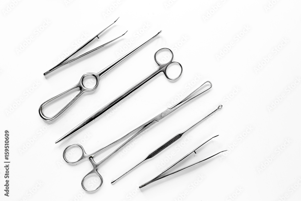 Medical instruments for plastic surgery on white backgrond top view copyspace Medical instruments for plastic surgery on white backgrond top view copyspace