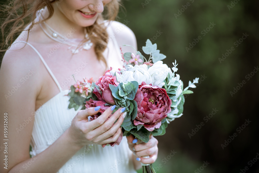 Naklejka premium Blonde bride in fashion white wedding dress with makeup