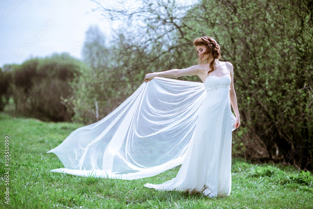 Blonde bride in fashion white wedding dress with makeup