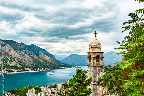 View of Kotor city, Church of Our Lady of Remedy, mediterranean sea, coastal town and mountain landscape in Bay of Kotor, Montenegro.