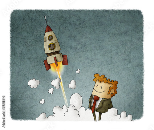 success businessman with rocket launching