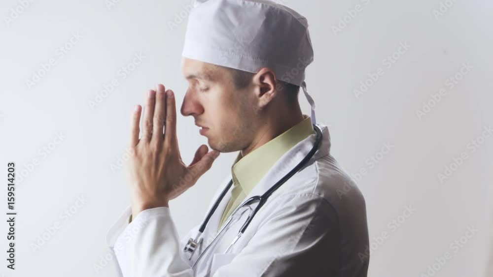 The doctor prays to the god. Powerlessness of medicine. Religion and medicine. The doctor prays to the god. Powerlessness of medicine. Religion and medicine.