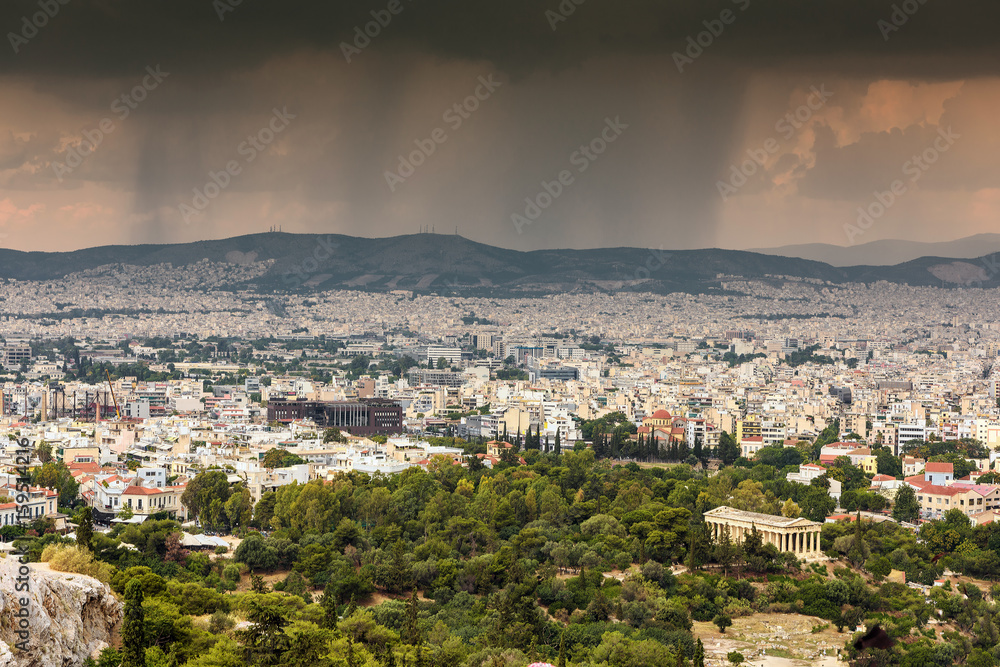 Obraz premium Rain falling over Athens, Greece; high angle view