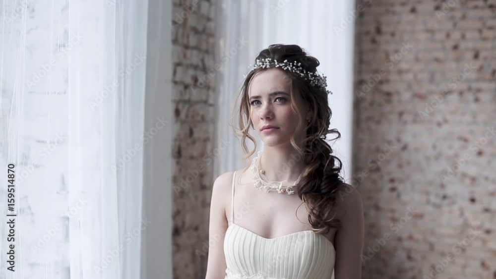 Brunette bride in fashion white wedding dress with makeup Brunette bride in fashion white wedding dress with makeup