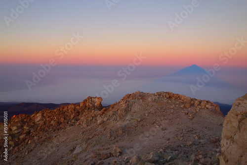 Teide Peak (the highest point in Spain - 3718 metres) casting its shadow like a pyramid at the sunrise, Tenerife, Canary islands, Spain