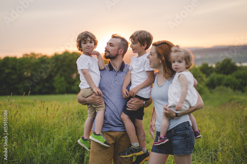 Happy family in the meadow