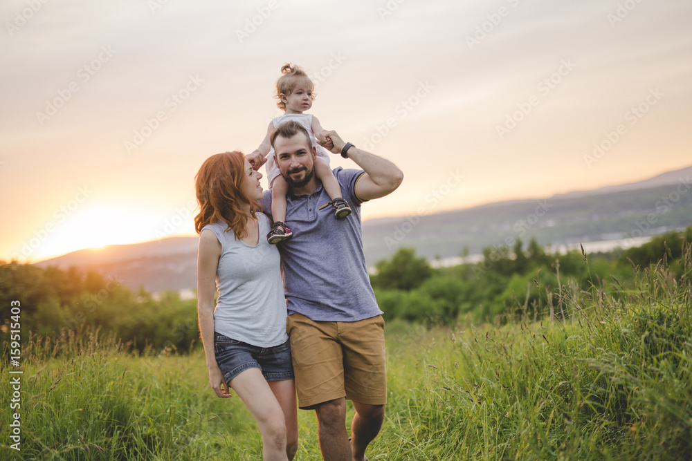 young father and mother with their cute daughter young father and mother with their cute daughter