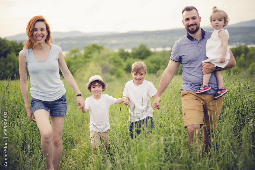 Happy family in the meadow