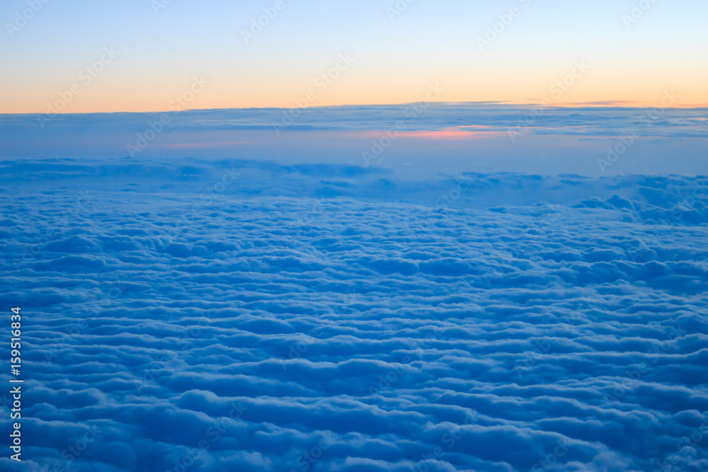 Photo of cloudy sunrise seen from above