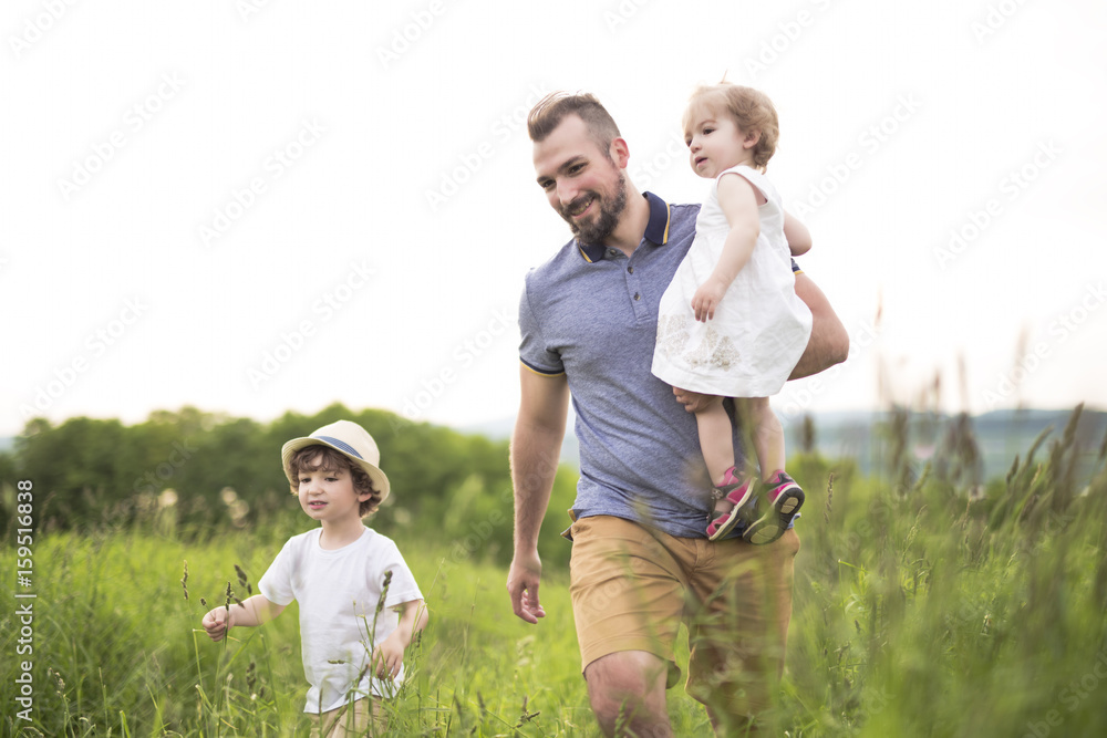 Fototapeta premium Happy young family on a walk