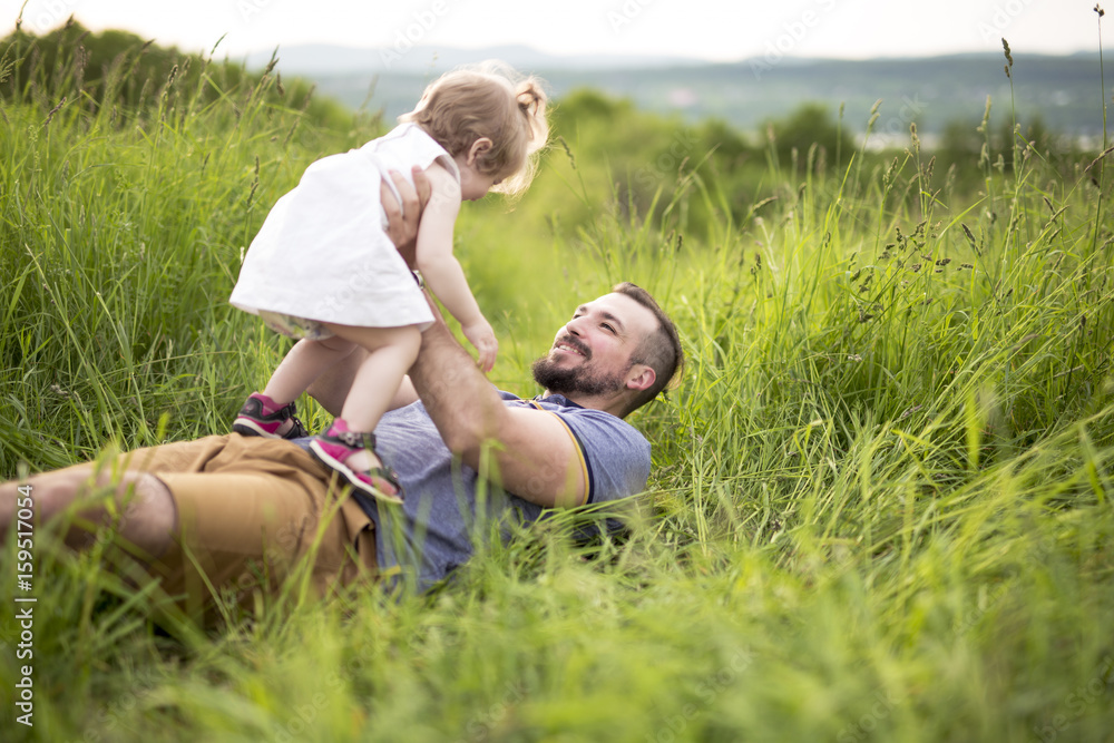 Beautiful portrait of young attractive father with daughter toddler Beautiful portrait of young attractive father with daughter toddler