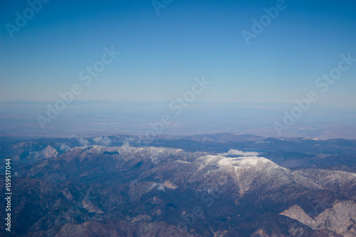 Photo of snowy mountain range seen from above