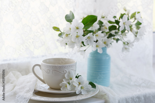 Romantic tea in the blossoming garden
