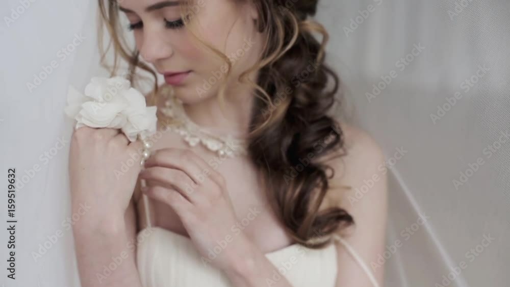 Brunette bride in fashion white wedding dress with makeup Brunette bride in fashion white wedding dress with makeup